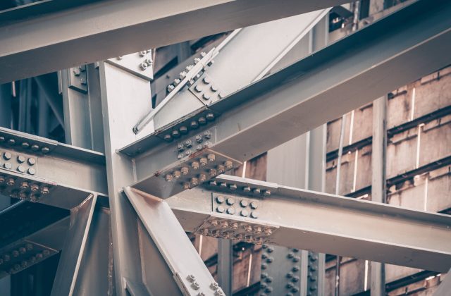 shutterstock_1056675149-min Structural steel beams used in industrial project